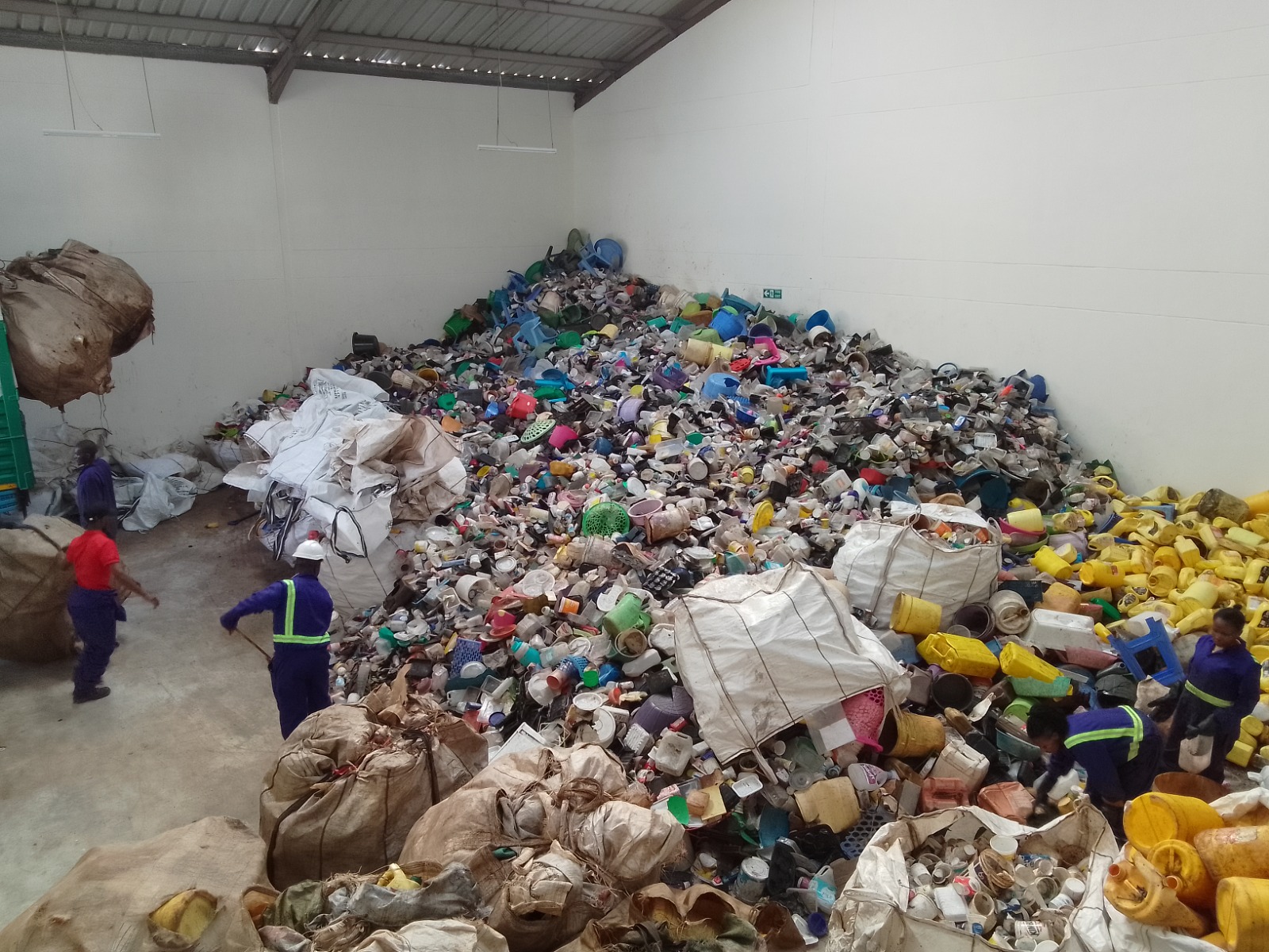 Plastic Recycling Facility Workers Sorting